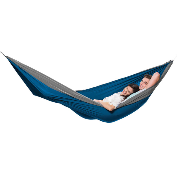 Coghlans double parachute hammock in grey/blue set-up with two people lying in it on a white background