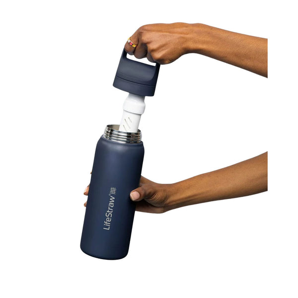 LifeStraw vacuum insulated 530ml stainless steel Go Series water filter bottle in Aegean Sea blue colour shown  with the filter being removed by the carry handle