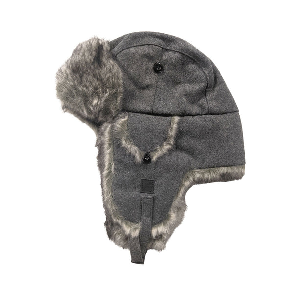 Studio photograph of the side of an Extremities Thermal Dylan Trapper Hat on a white background