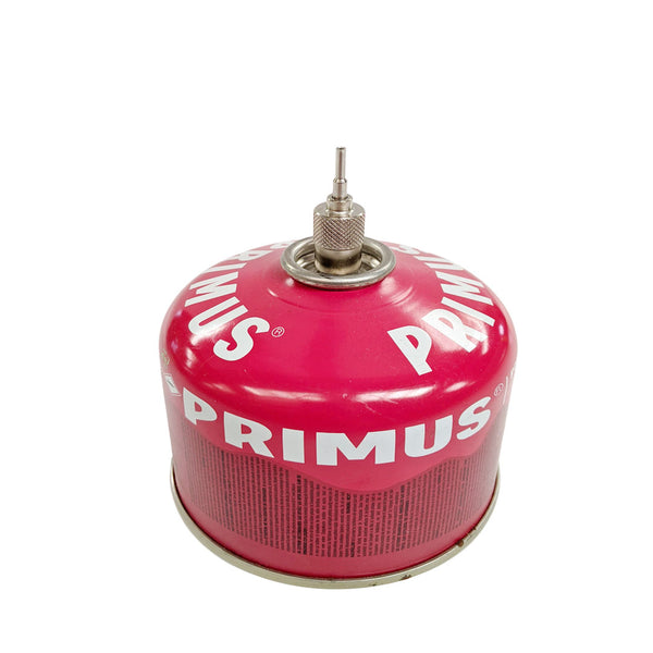 Studio shot on a white background of a Primus Power Lighter Gas Filling Adaptor attached to the top of a Primus Power Gas canister